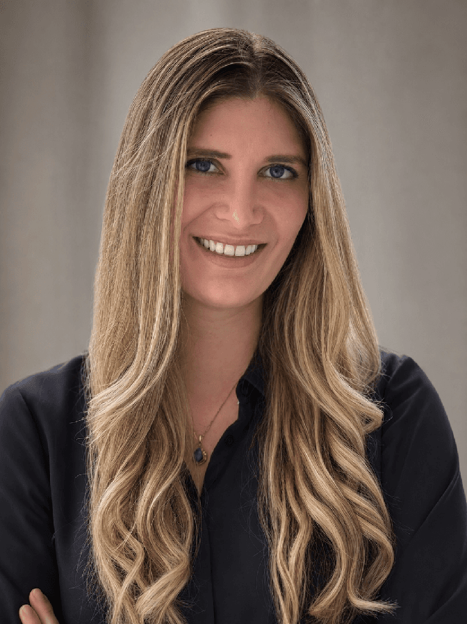 Portrait of Rebecca Share-Howard against a plain grey backdrop